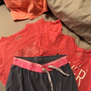 UA brand.  2 shirts and 1 shorts.